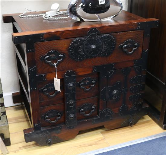 A Japanese style iron mounted wheeled chest, tansu, W.74cm